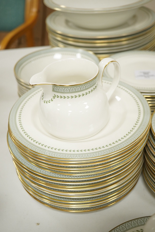 A Royal Doulton Berkshire pattern part dinner service to include tureens, twin handled cups and oval platters, largest 33cm wide. Condition - mostly good